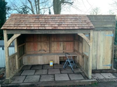 COLIN'S SUMMERHOUSE PROUDLY SITS ON A TILED FLOOR EDGED WITH NEW RAILWAY SLEEPERS
