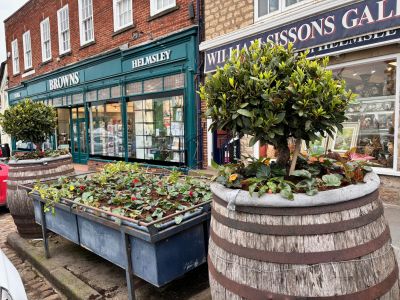 HELMSLEY'S ANCIENT MARKET SQUARE DECORATED WITH OAK BARREL PLANTERS