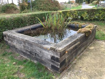 WE ALL GO GREY IN THE END! WEATHERED RAISED POND BUILT WITH OAK RAILWAY SLEEPERS